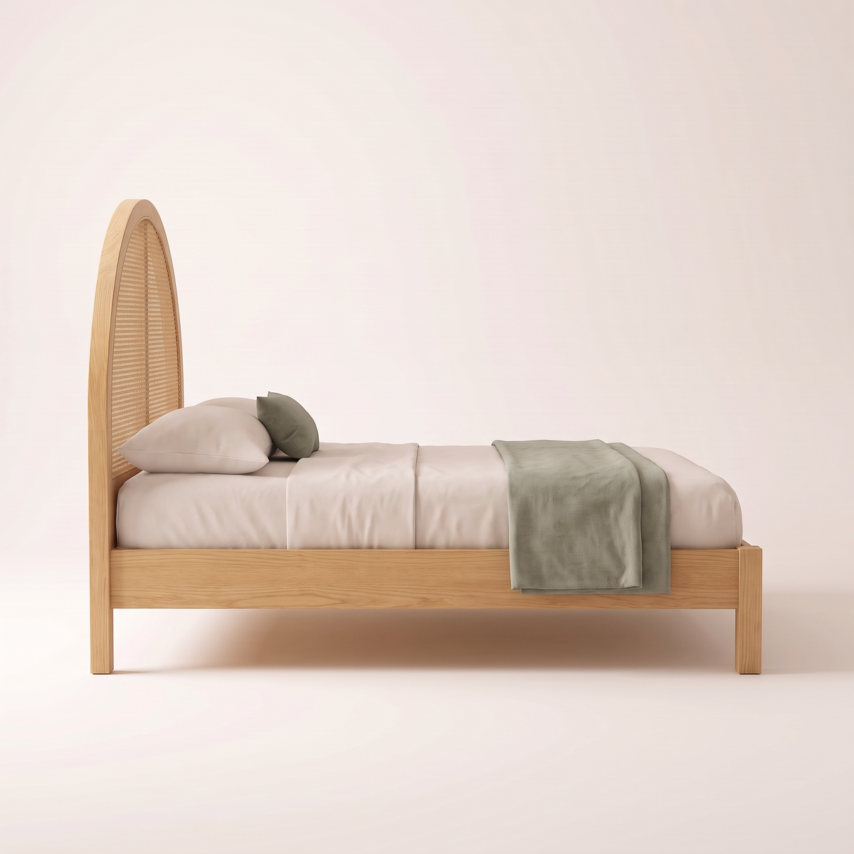 The Cloister Cane Bed, side profile showing the tall arched headboard, low side rail and short square ash legs