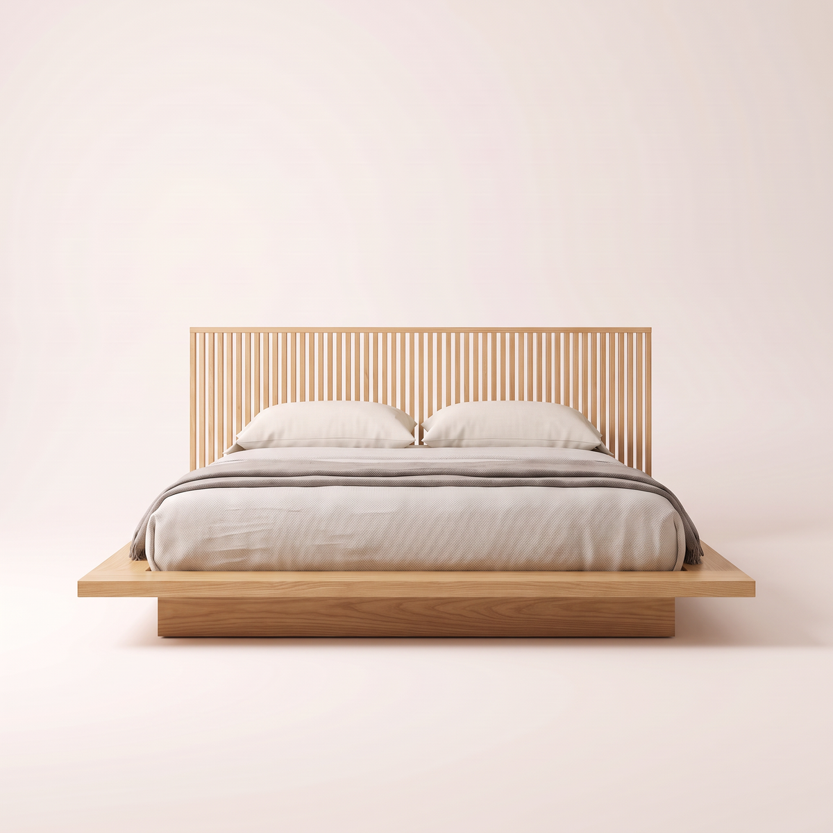 The Lowland Bed seen from the foot, showing the slatted ash headboard and floating platform ledge