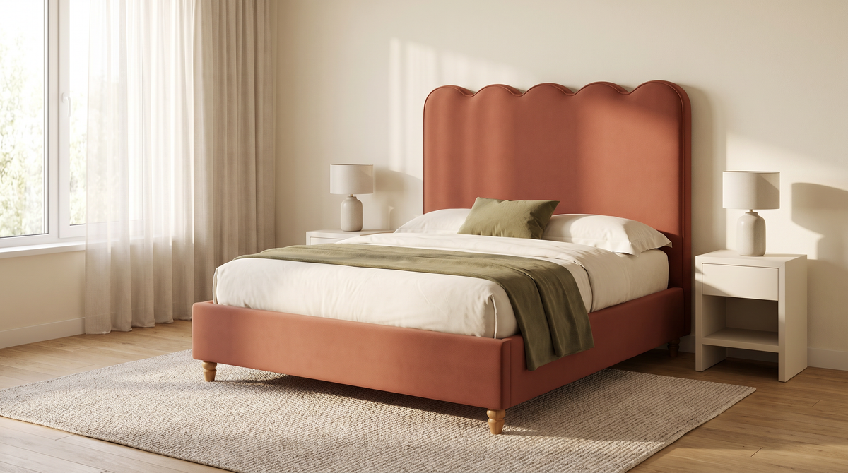 The Petal Bed with scalloped rust headboard styled in a calm, sunlit bedroom