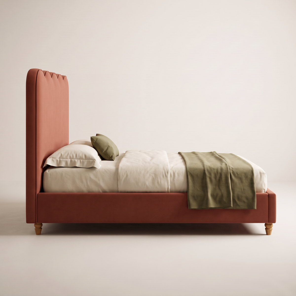 The Petal Bed, side profile showing the padded headboard, slim upholstered rail and turned ash feet