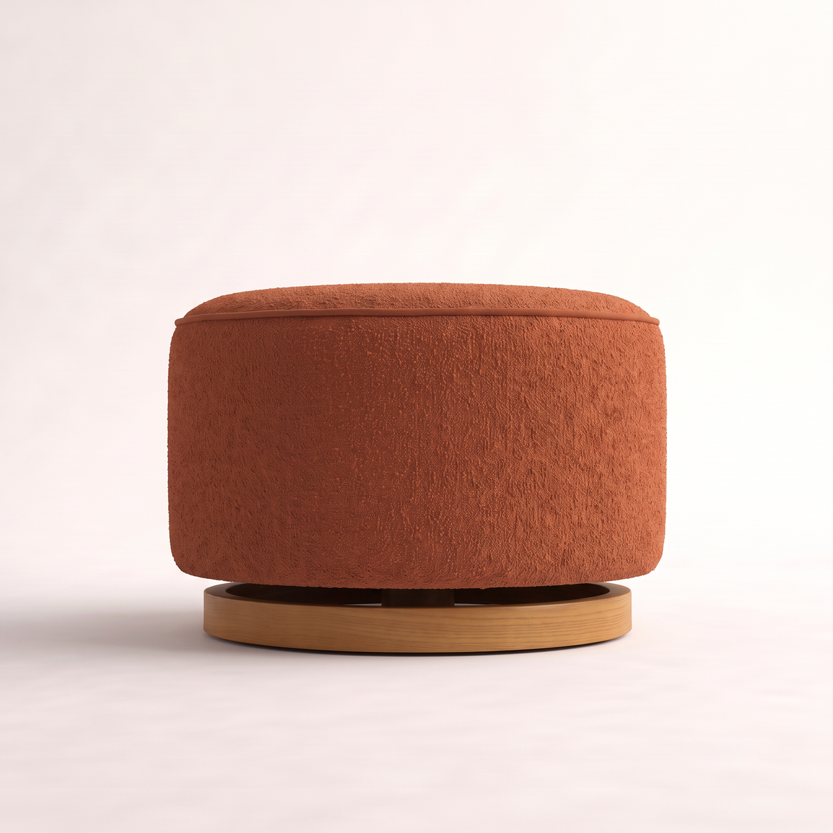 Tondo Rust round drum ottoman in rust bouclé, low side elevation showing the floating ash plinth