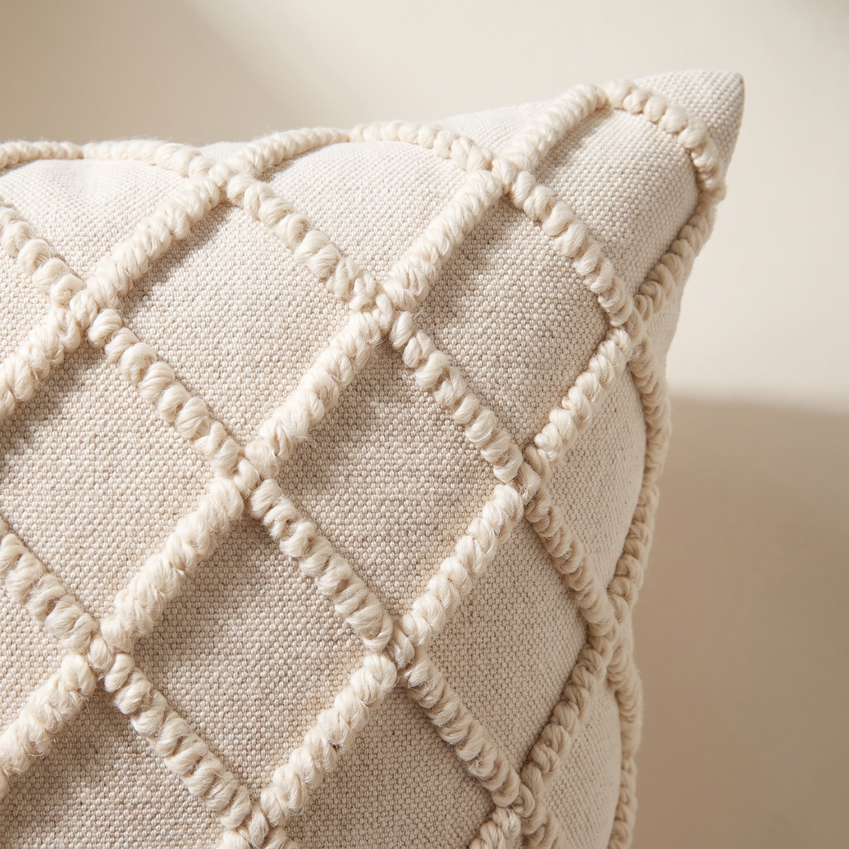 Close-up of Tufted Loop Cushion showing hand-tufted wool loops on woven cotton
