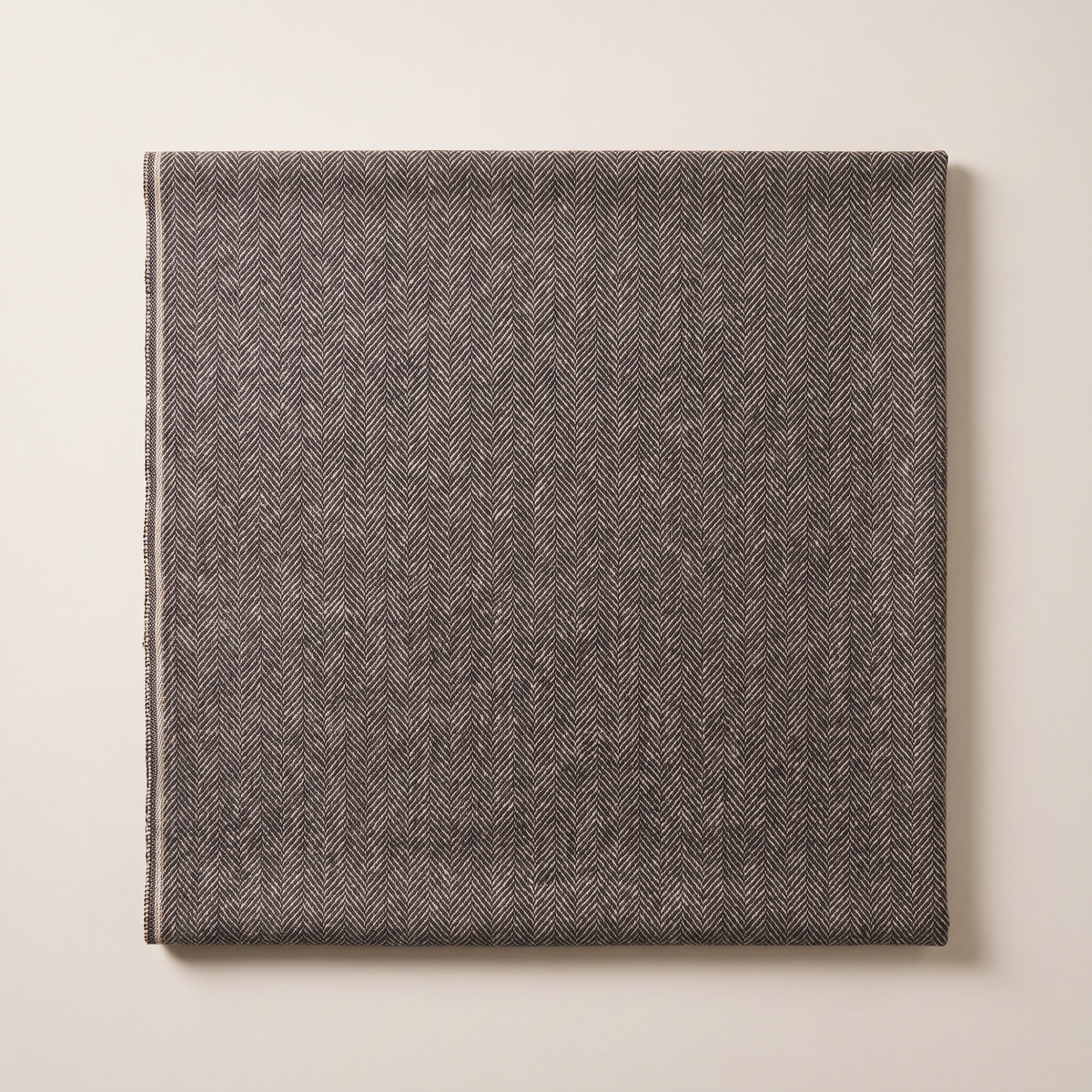 Tweed Herringbone upholstery fabric, flat swatch seen from above showing the small herringbone