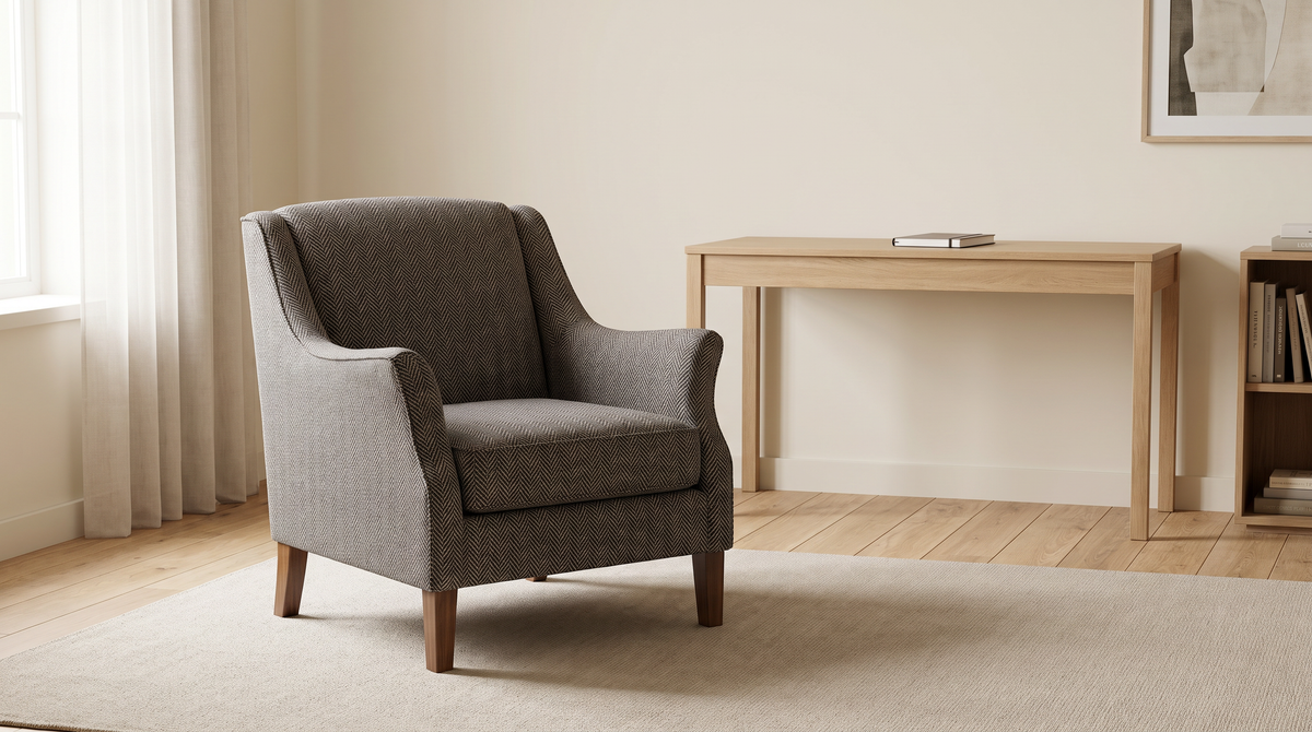 Tweed Herringbone fabric shown as the upholstery of a classic armchair in a calm home study