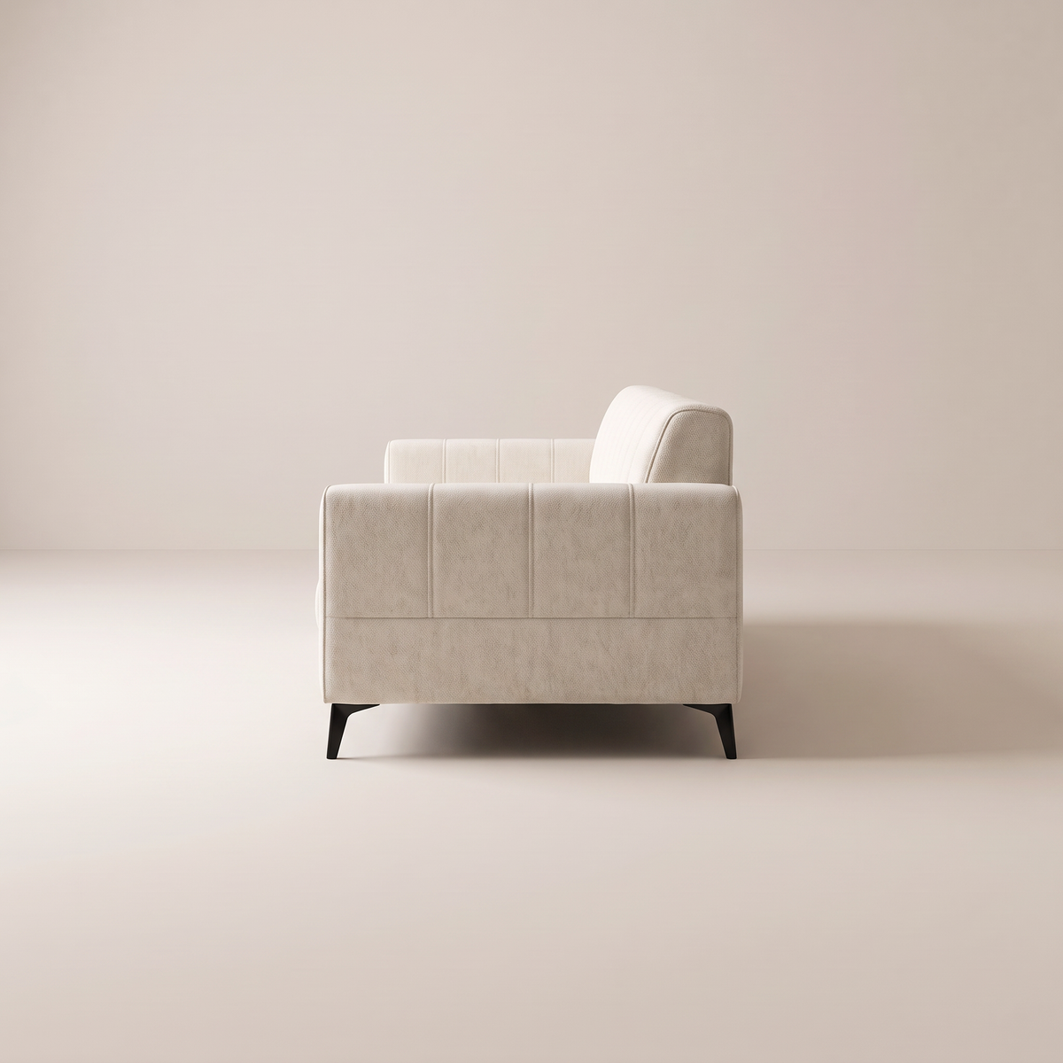 Vela Ivory sofa in ivory cream upholstery, side profile view