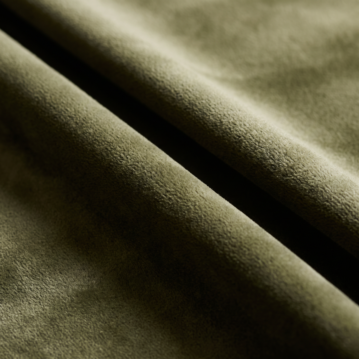 Velvet Olive upholstery fabric, close-up of folds showing the short pile and sheen