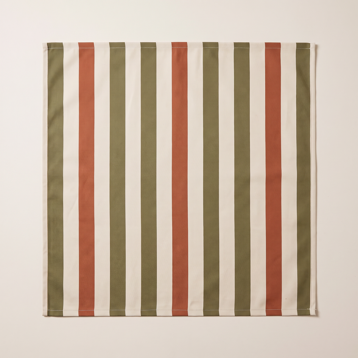 Verandah Stripe outdoor fabric, flat swatch seen from above showing the olive, ivory and rust stripes