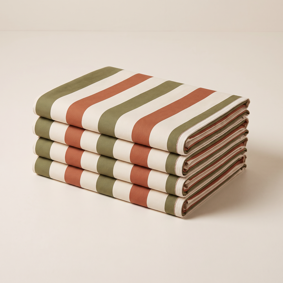 Verandah Stripe outdoor fabric, neatly folded stack of striped canvas