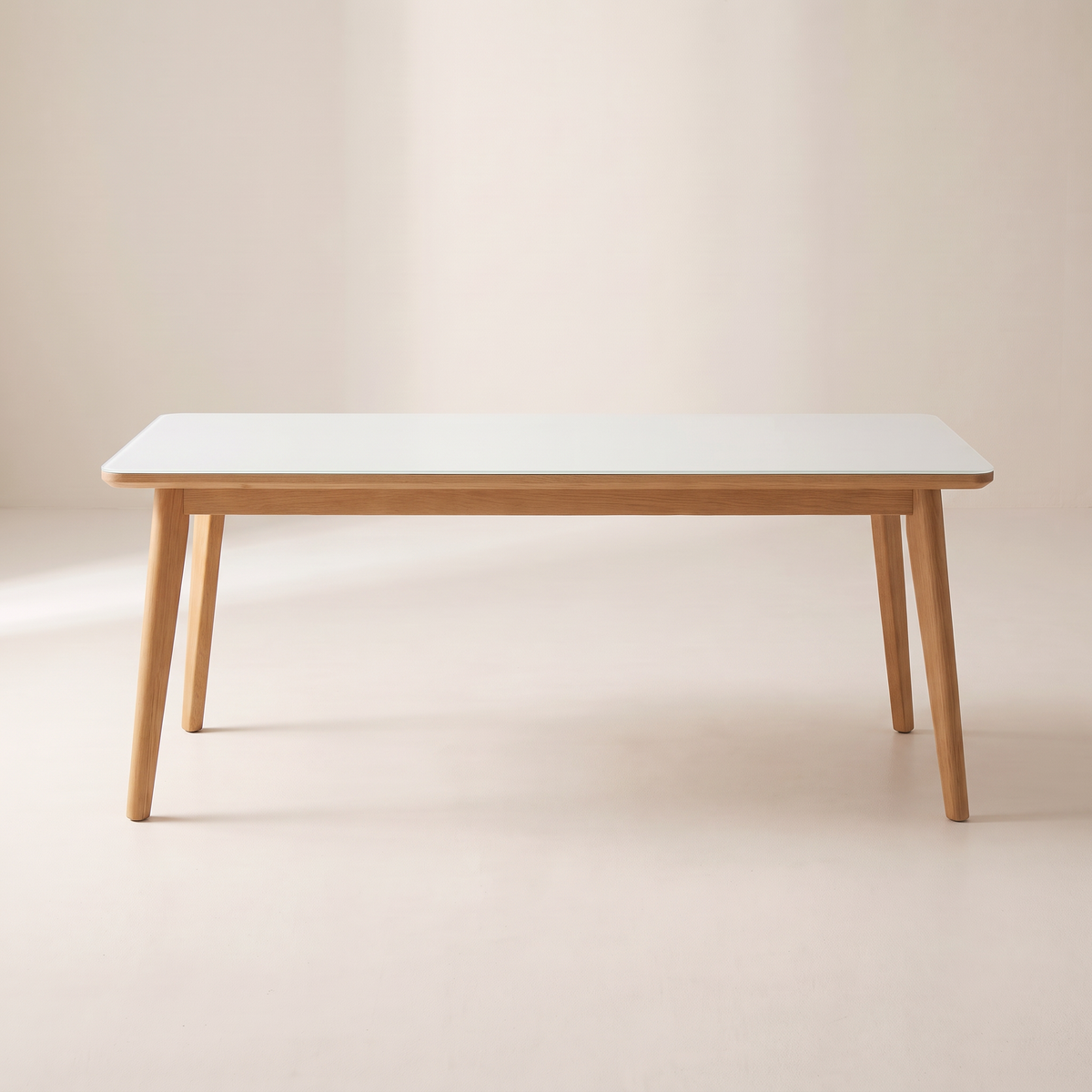 Vista Dining Table with white glass top and light wood frame, front elevation view