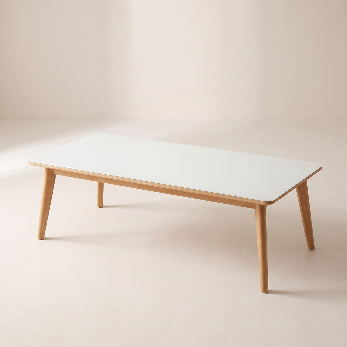 Vista Dining Table with white glass top and light wood frame, elevated three-quarter view