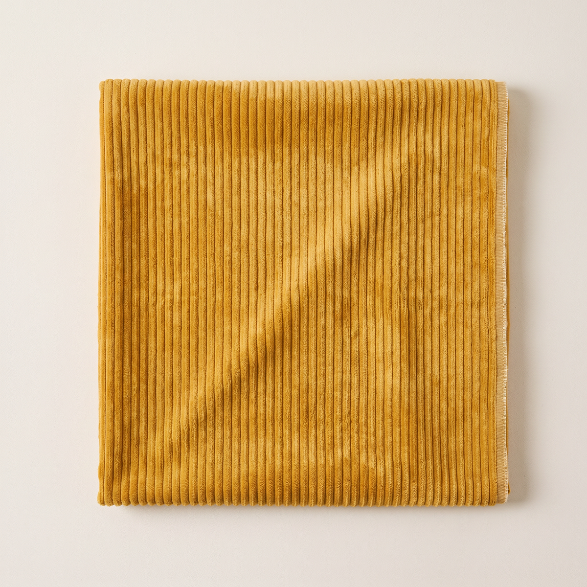 Wide Wale Corduroy upholstery fabric, flat swatch seen from above showing the wide ochre ribs